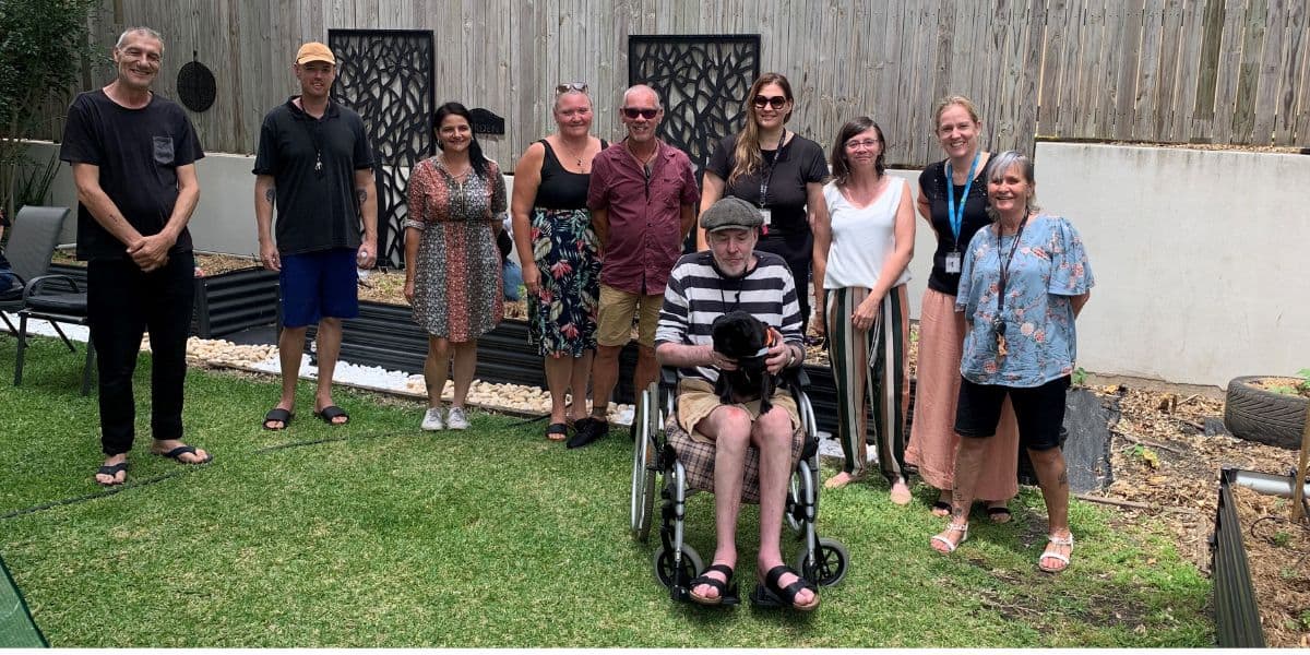 Redcliffe clients and Open Minds staff together at the reopening of their community garden